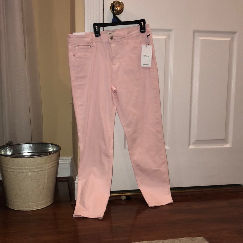 Pale pink skinny jeans